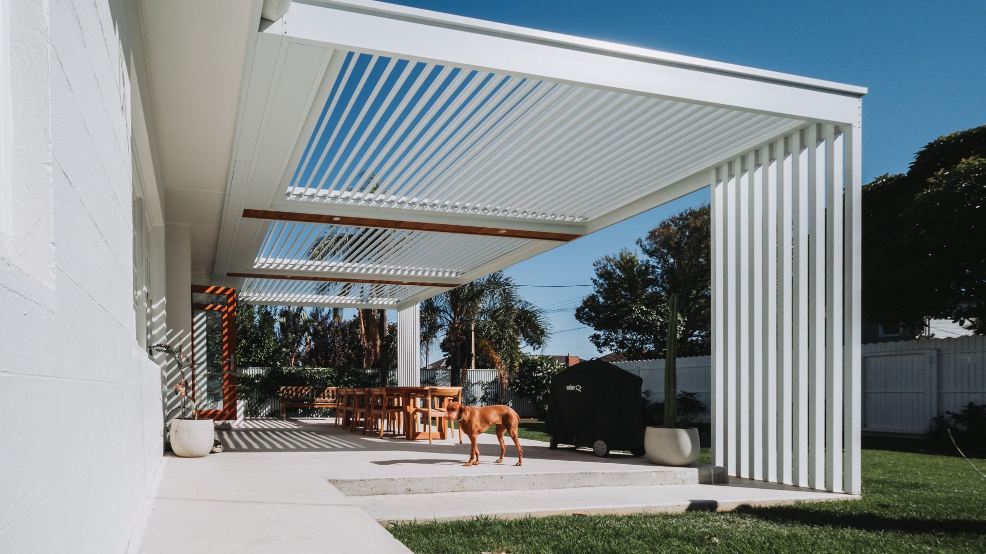 Eclipse - White opening louvre roof over backyard outdoor entertaining area