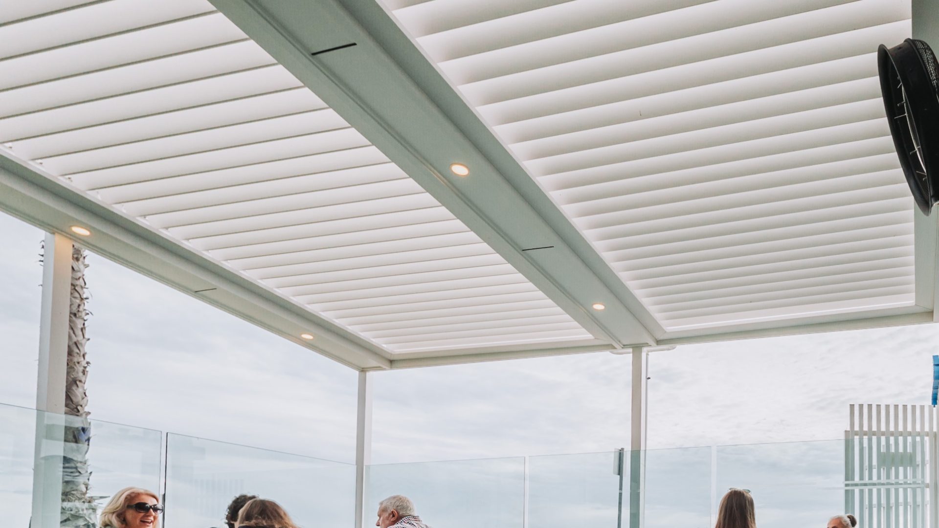 Eclipse - Palais Hotel outdoor dining terrace beneath an aluminium louvre roof