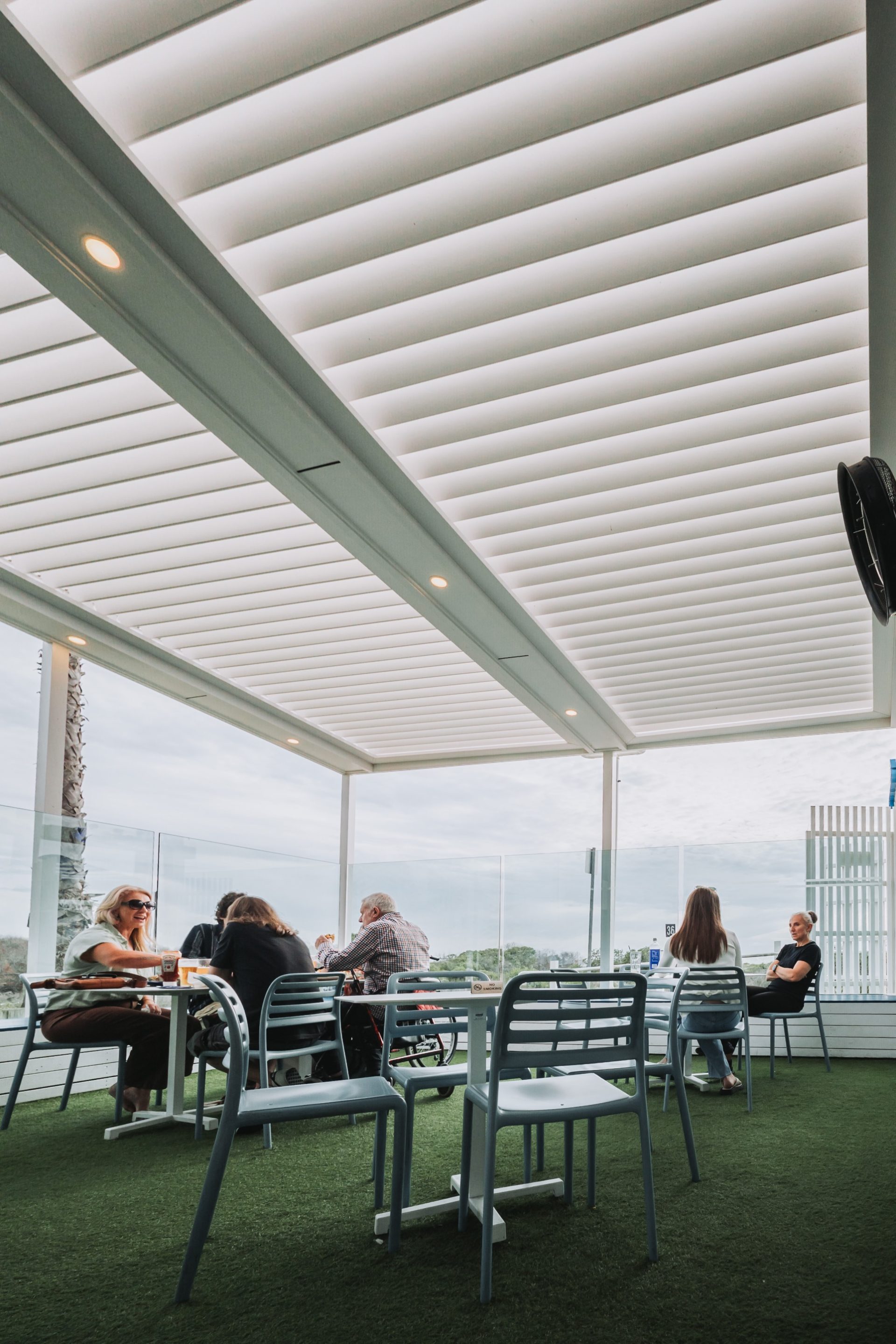 Eclipse - Palais Hotel outdoor dining terrace beneath an aluminium louvre roof
