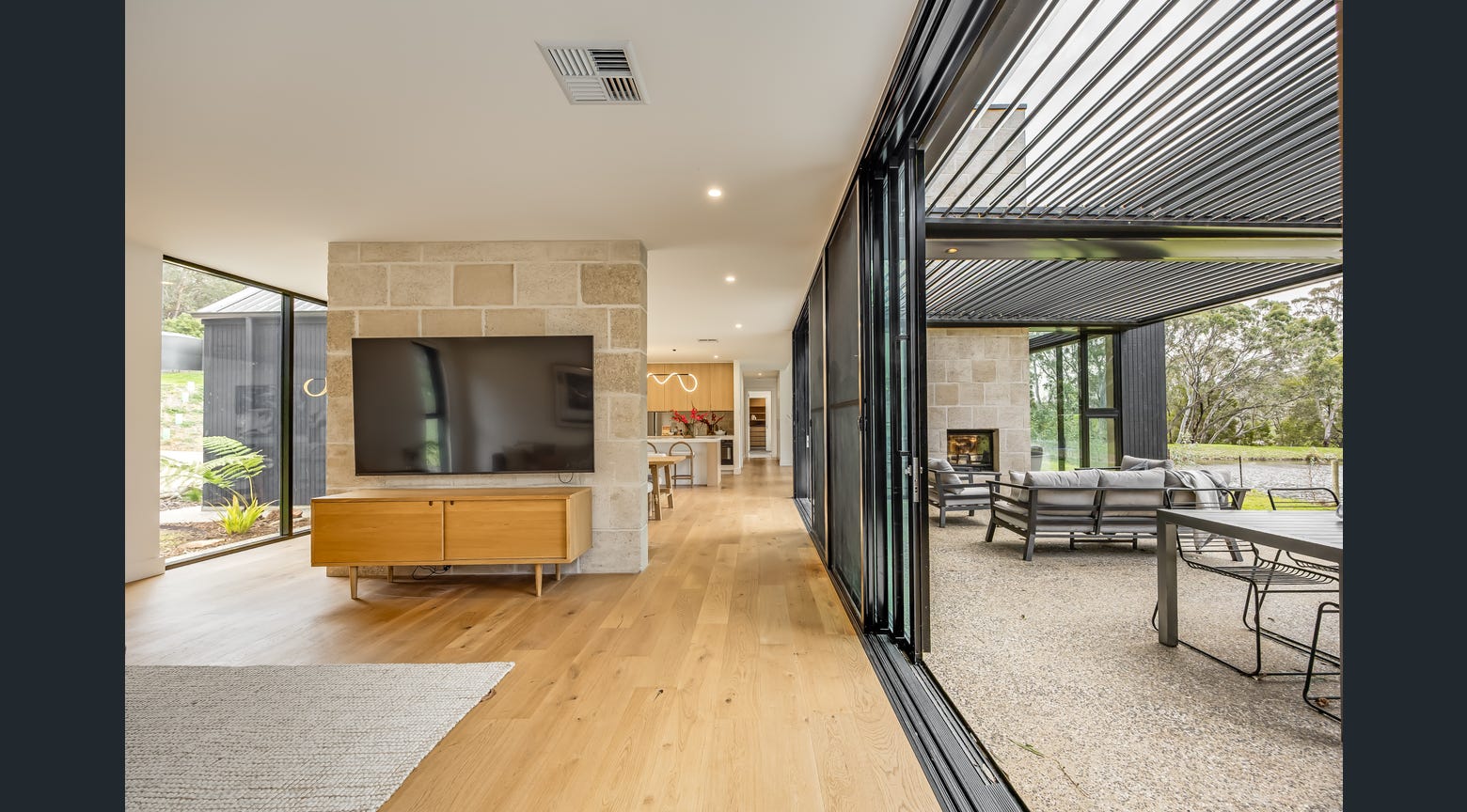 Eclipse - Modern home with Eclipse opening louvre roof over outdoor entertaining area